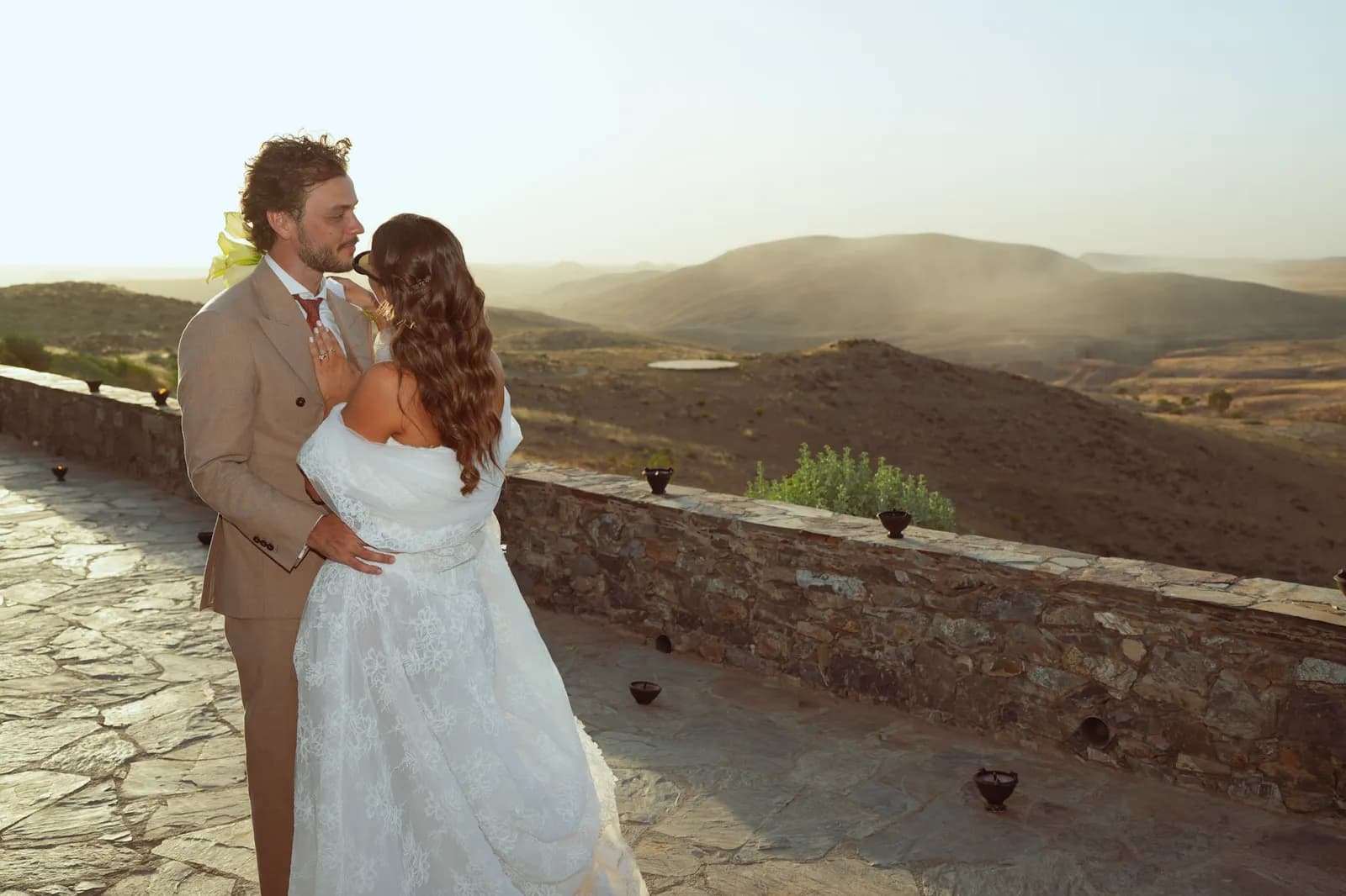 Couple reuniting on the kasbah garden steps, destination wedding near Marrakech