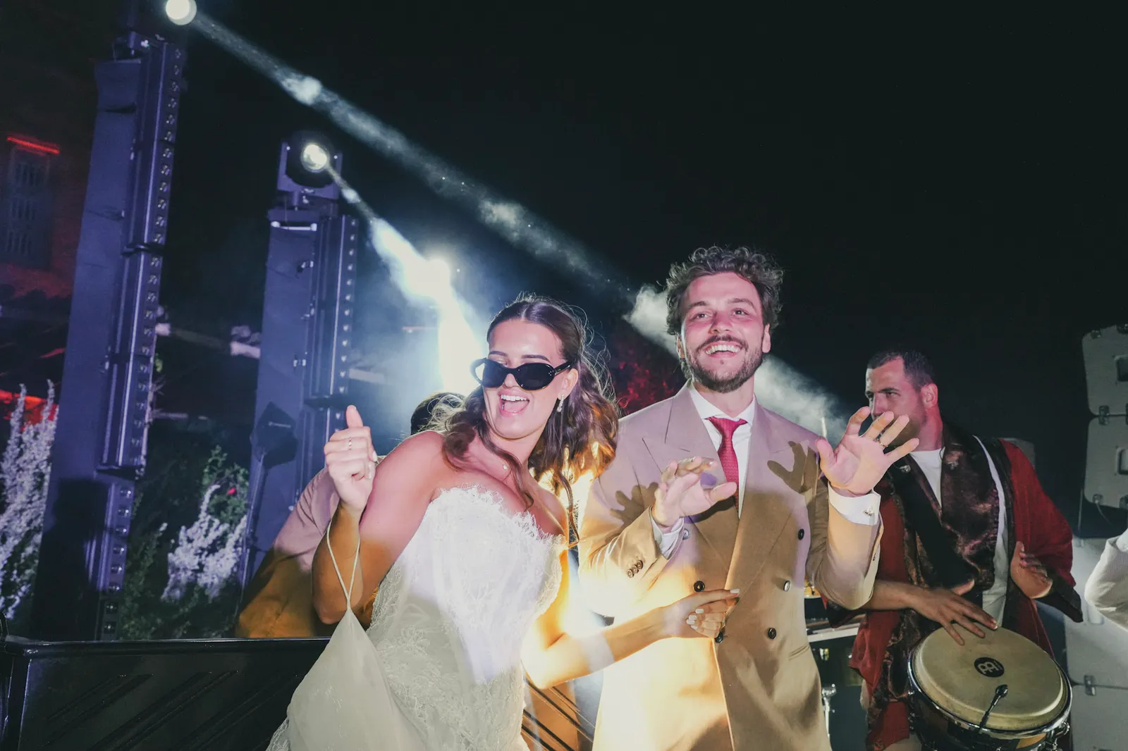 Bride and groom dancing with the live band at their Agafay desert reception