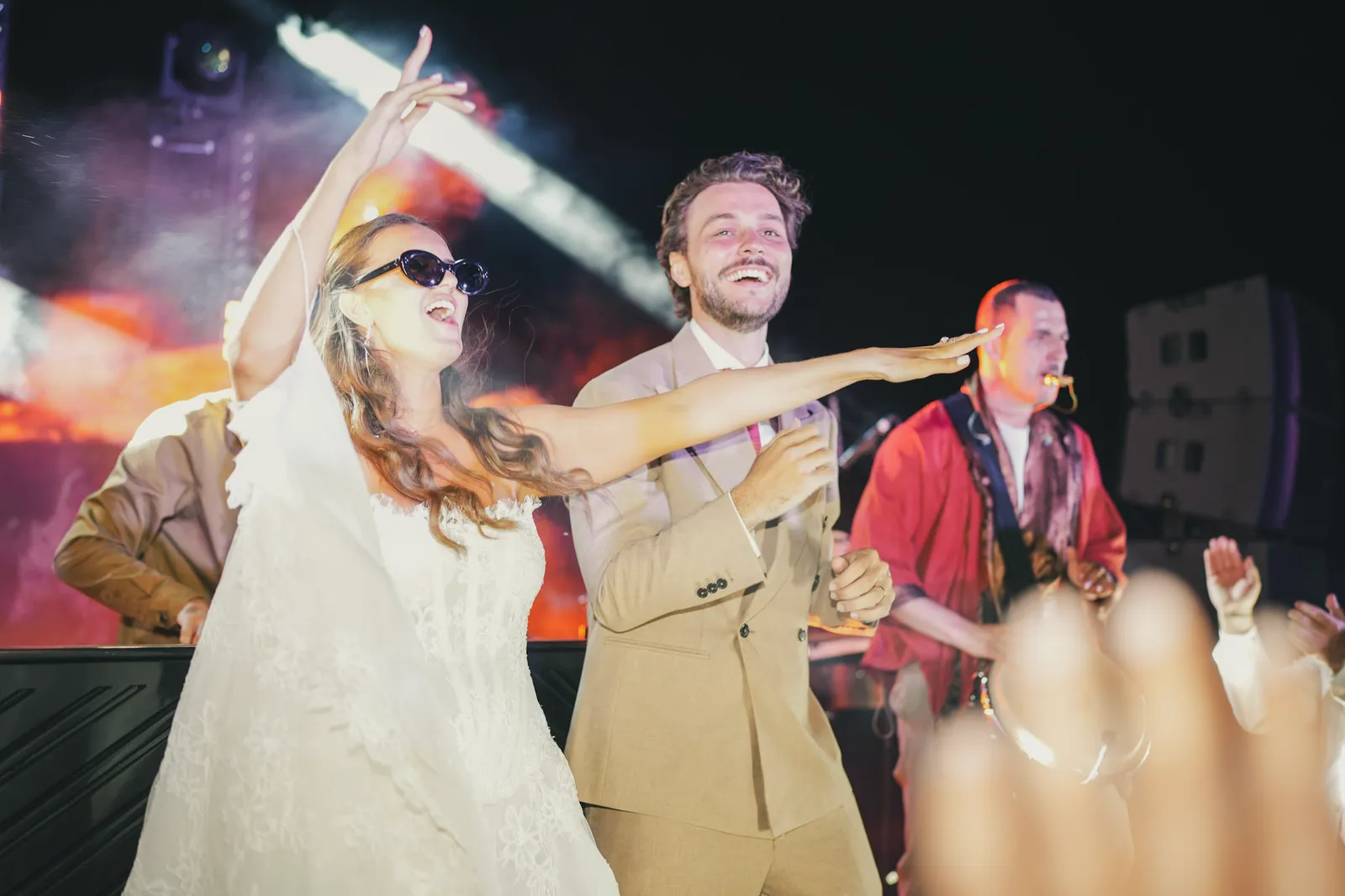Newlyweds dancing into the night at their Marrakech desert celebration