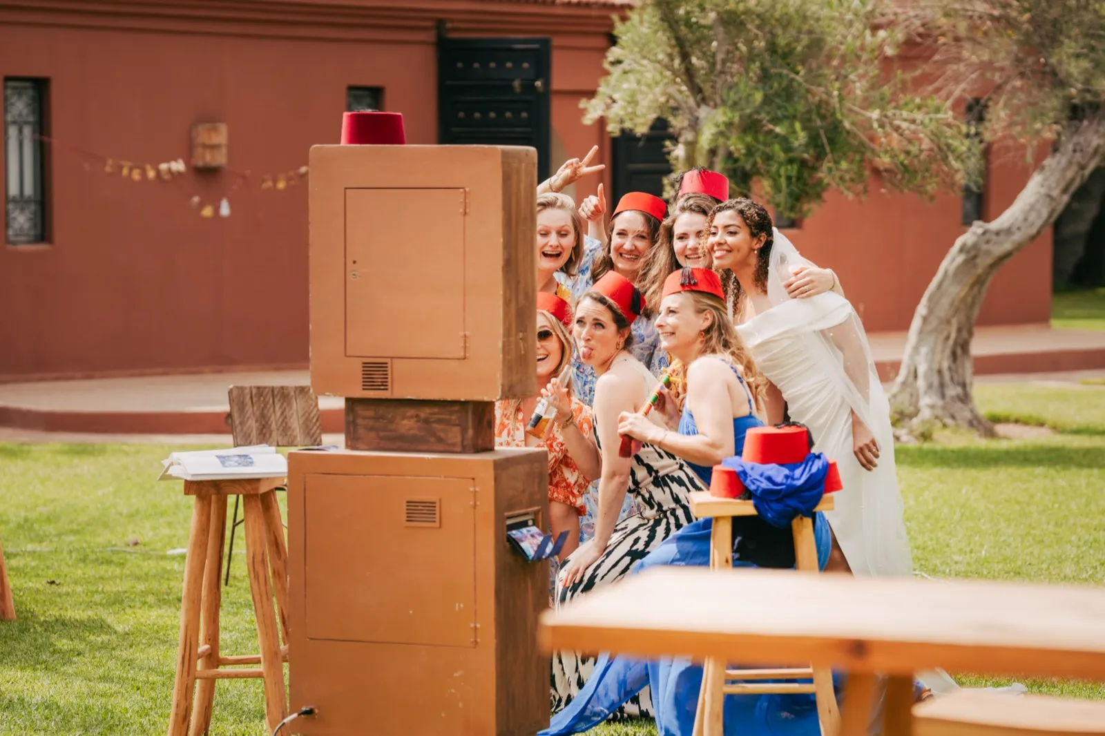 Wedding guests at photo booth during Marrakech garden party, A & S 2024