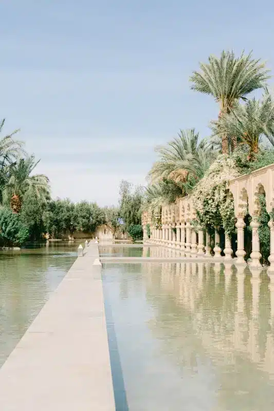 H wedding couple celebrating in Marrakech garden, 2025
