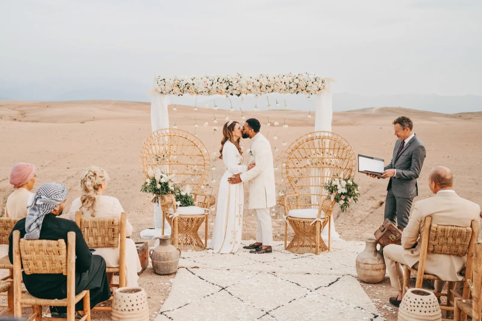 Intimate desert ceremony with floral arch near Marrakech, J & L 2024