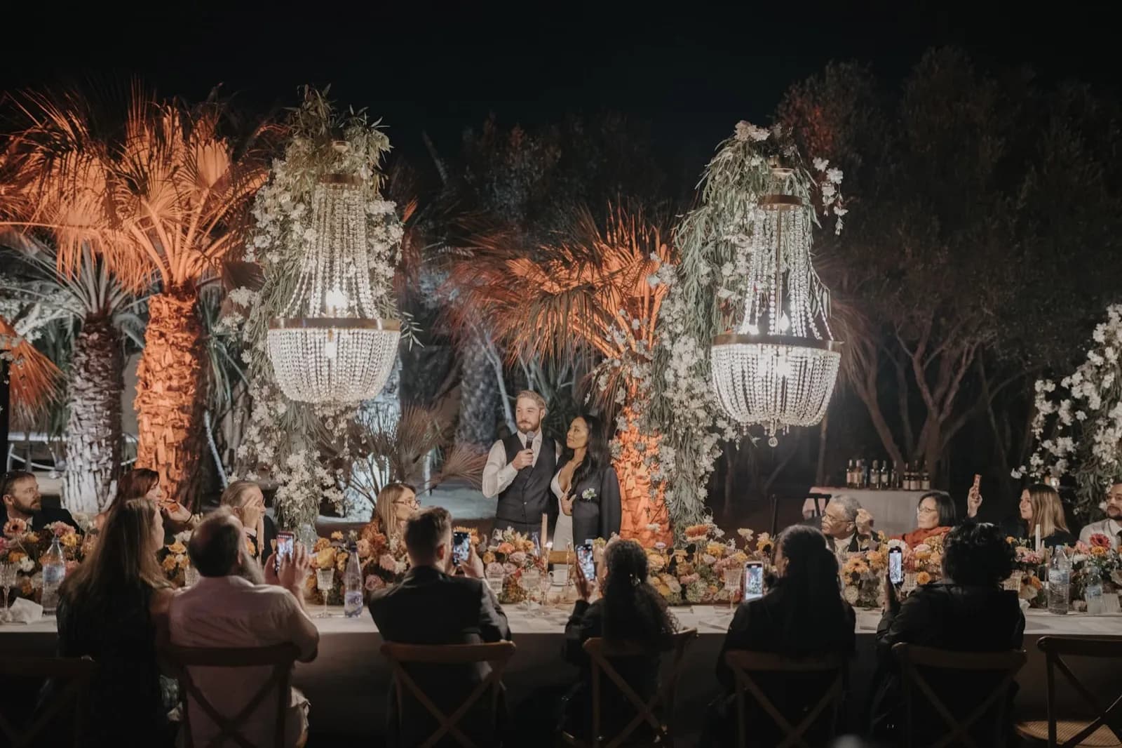 Wedding couple walking through Marrakech riad garden, 2025